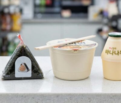 Triangle kimbap and instant ramen on a Korean convenience store shelf
